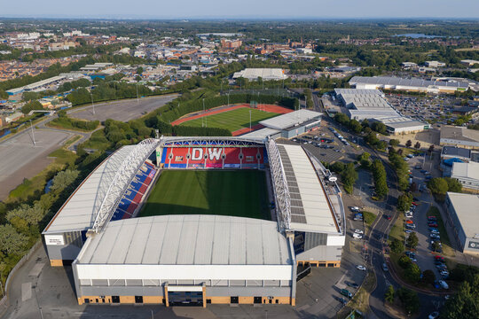 Aerial Image of The Brick Community Stadium, Robin Park Arena and Townscape in Wigan