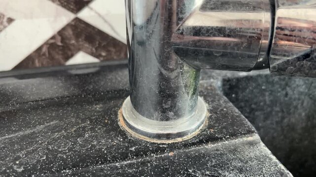Kitchen faucet with limescale buildup and water drops, hard water stains, household cleaning and plumbing maintenance concept