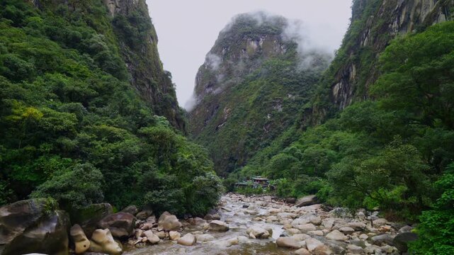 Amazon Urabumba river Machu Picchu Aguas Calientes dry rainy season misty clouds Peru jungle hillside Peruvian Andes Mountains lower highlands Inca trail citadel nature landscape static