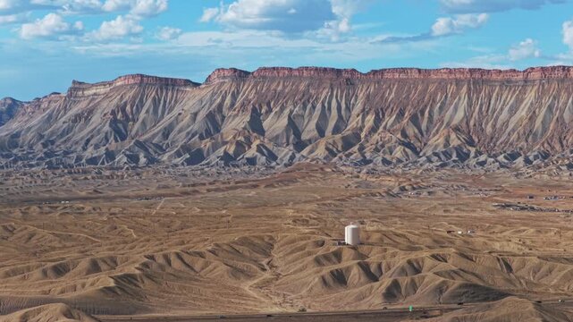 Grand Junction aerial drone afternoon cloudy Grand Mesa Colorado River summer blue sky wine vineyards Parachute Fruitvale Mt Garfield Western Close Delta downtown Main Street circle left motion