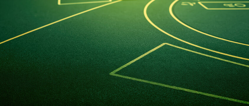 emerald green felt casino table texture closeup with stitched seams for luxury gambling branding web design advertising background evoking sophisticated nightlife ambiance
