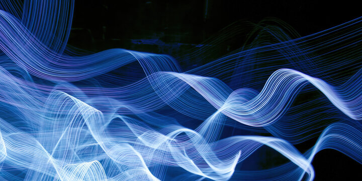 fiery azure light trails swirl across void backdrop evoking kinetic energy for advertising web design social media editorial projects radiating vibrant dynamic motion
