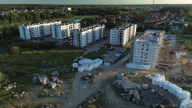 Tower Crane and Residential Building Under Construction During Golden Hour &mdash; Drone Perspective