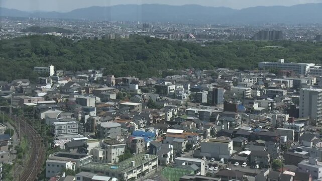 Footage panning across a bird's-eye view of Sakai City, Osaka, from left to right.