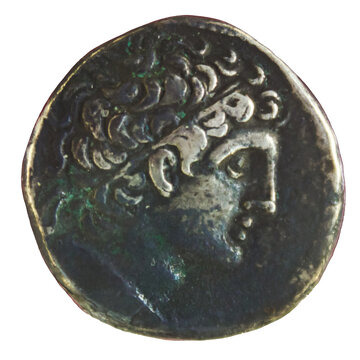 Ancient Greek silver coin featuring profile of a young King Ptolemy with curly hair
