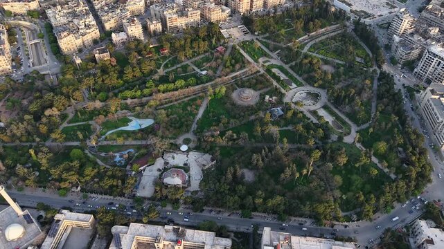 Drone view of a city landscape in Aleppo, Syria. Urban skyline and residential neighborhoods from above. City streets, infrastructure, and middle eastern architecture.