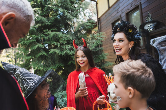 Family enjoys a joyous Halloween evening with costumes and treats together