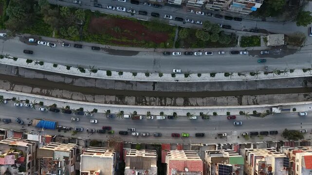 Drone view of a city landscape in Aleppo, Syria. Urban skyline and residential neighborhoods from above. City streets, infrastructure, and middle eastern architecture.