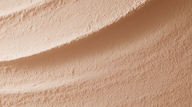 Tadelakt polished plaster wall texture background in warm sand tone