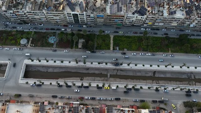 Drone view of a city landscape in Aleppo, Syria. Urban skyline and residential neighborhoods from above. City streets, infrastructure, and middle eastern architecture.