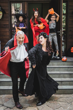 Family revels in a cozy Halloween night in whimsical costumes