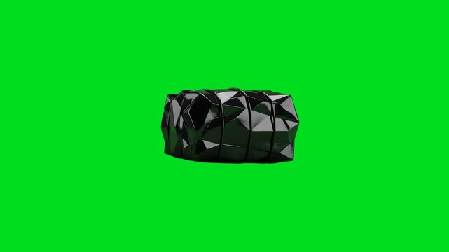 A glossy black geometric object isolated against a vivid green background