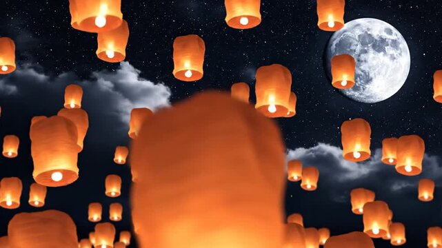 Glowing sky lanterns floating into the dark night sky with full moon