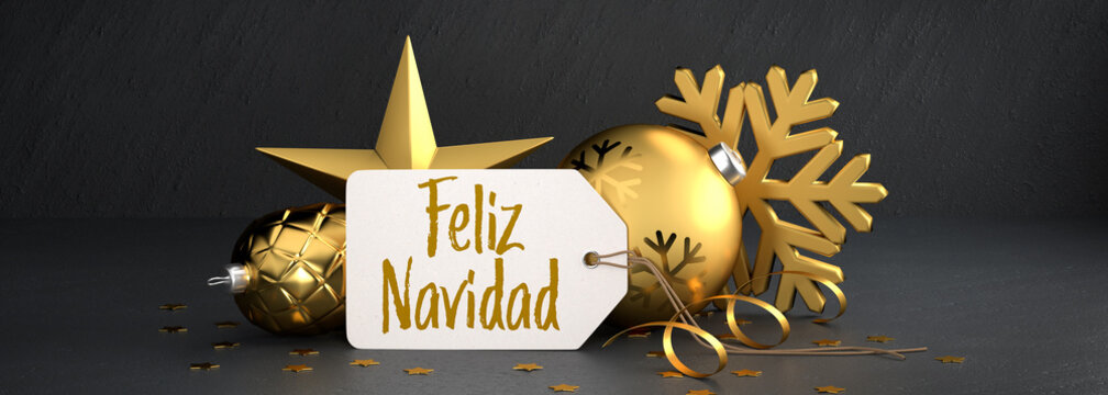 Christmas - Gift Tag with the Spanish message "Feliz Navidad" (Merry Christmas) on a black stone background leaning against gold colored christmas ornaments. Banner size