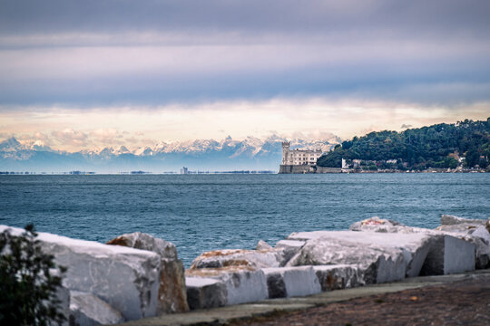 Trieste in winter. Between the sea, snow-capped mountains, and historic monuments.