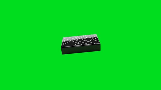 A sleek black rectangular box featuring white geometric line art patterns