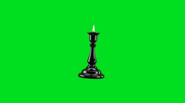 A single burning candle centered inside an elegant black metal holder