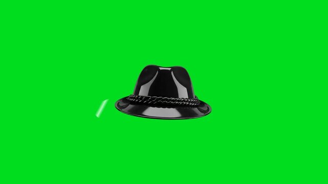 A sleek black fedora hat isolated against a vibrant green screen background