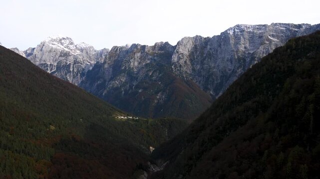 Aerial ascending toward the rugged peaks above Strmec and Predil Pass, Slovenia