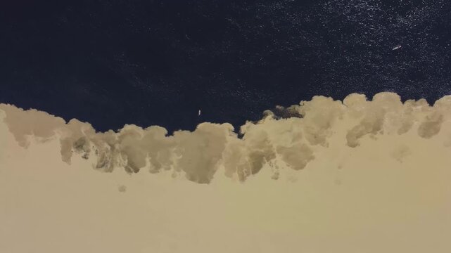 Overhead aerial view of the confluence of the Orinoco and Caron&iacute; rivers, where murky and dark waters meet