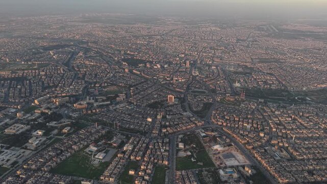 Drone view of a city landscape in Aleppo, Syria. Urban skyline and residential neighborhoods from above. City streets, infrastructure, and middle eastern architecture.