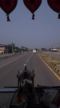 Vertical Road Trip Footage from Vehicle Through Scenic Highway, Cars and Bus Traveling on Modern Indian Road, Dashboard Religious Shrine and Traditional Decoration, Transportation, Travel and Tourism
