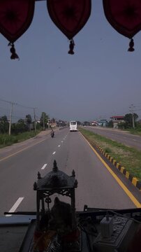Vertical Road Trip Footage from Vehicle Through Scenic Highway, Cars and Bus Traveling on Modern Indian Road, Dashboard Religious Shrine and Traditional Decoration, Transportation, Travel and Tourism