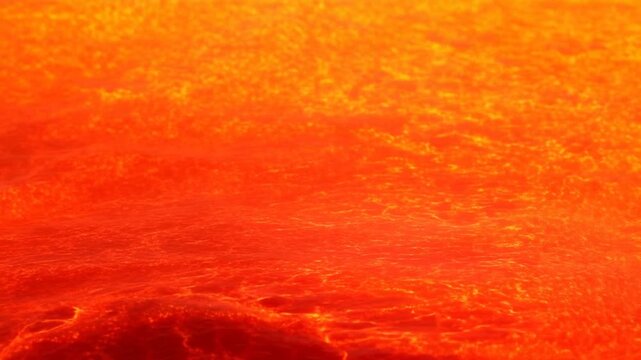 Molten lava surface flowing with glowing orange currents across dark volcanic crust