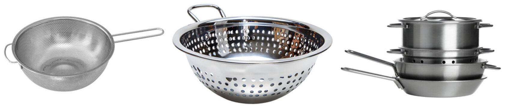 Three stainless steel kitchen strainers and a stack of pots and pans isolated on white background