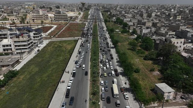 Drone view of a city landscape in Aleppo, Syria. Urban skyline and residential neighborhoods from above. City streets, infrastructure, and middle eastern architecture.