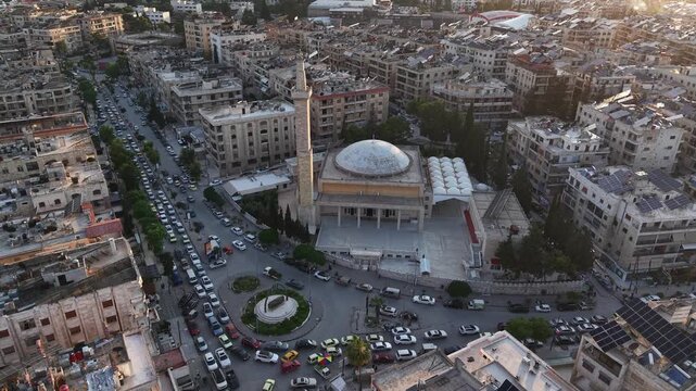 Drone view of a city landscape in Aleppo, Syria. Urban skyline and residential neighborhoods from above. City streets, infrastructure, and middle eastern architecture.