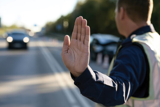 Two men are seen conversing amicably beside their vehicles involved in a traffic incident, reflecting the importance of communication and resolution in unexpected situations.