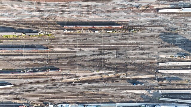 Aerial view of the Bahnhofsviertel railway yard featuring a complex network of tracks, trains, and overhead lines in Frankfurt am Main, Hessen, Germany.