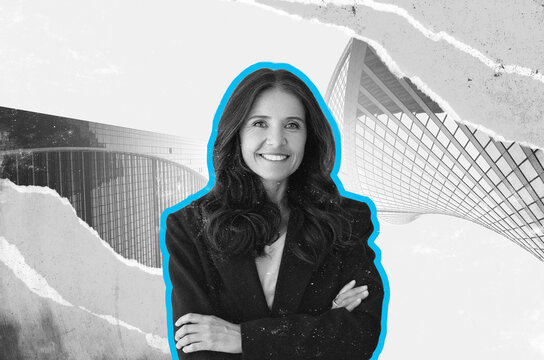 Confident Businesswoman Smiling While Standing In Modern Office Space With Architectural Features. Professional Female Executives Displaying Positivity And Success In Business Environment.