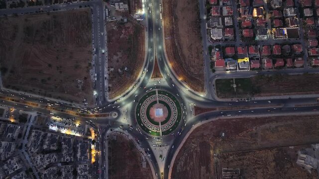 Drone view of a city landscape in Aleppo, Syria. Urban skyline and residential neighborhoods from above. City streets, infrastructure, and middle eastern architecture.