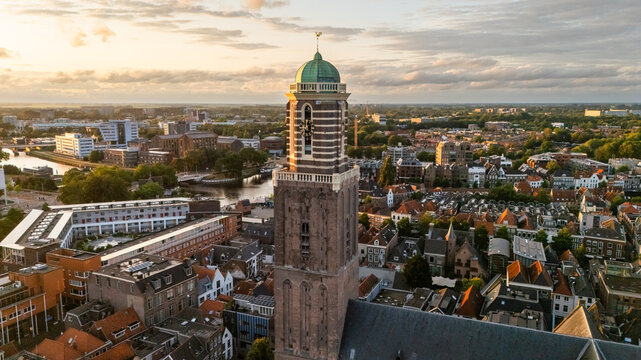 Aerial view of the Grote of Sint-Michaelskerk tower rising above the historic rooftops and urban landscape of Zwolle, Overijssel, Netherlands.