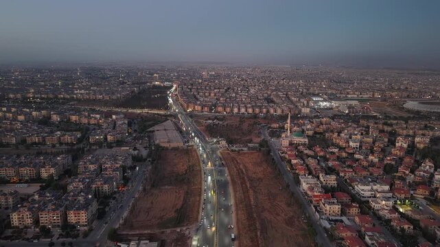 Drone view of a city landscape in Aleppo, Syria. Urban skyline and residential neighborhoods from above. City streets, infrastructure, and middle eastern architecture.