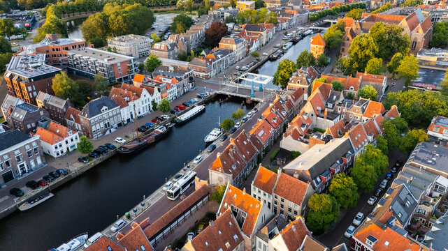 Aerial view of the historic city center of Zwolle, featuring canals, traditional Dutch architecture with red-tiled roofs, and a drawbridge in Zwolle, Overijssel, Netherlands.