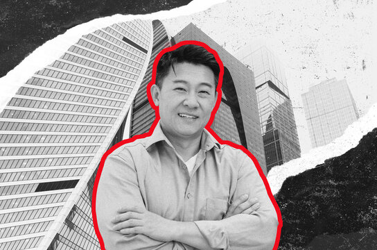 Confident Smiling Asian Male Businessman Arms Crossed Standing In Modern Office Setting, Exuding A Sense Of Professionalism And Success In The Business Environment.