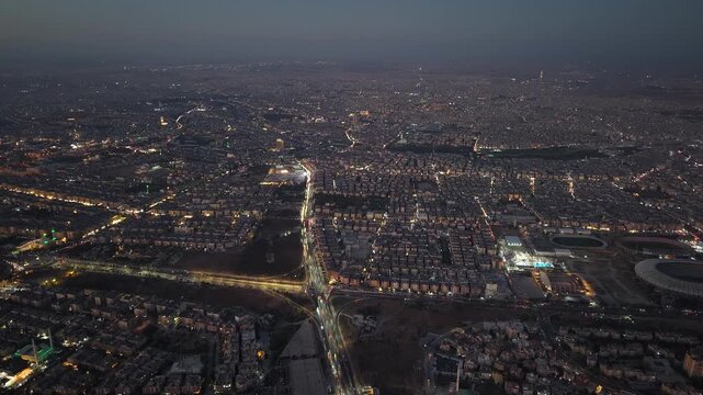 Drone view of a city landscape in Aleppo, Syria. Urban skyline and residential neighborhoods from above. City streets, infrastructure, and middle eastern architecture.