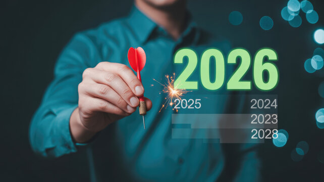 Business professional targeting future success goals with strategic planning for year twenty twenty six concept with glowing digital with red dart toward
