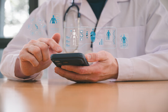 Doctor or healthcare staff using a mobile phone for virtual consultation. Telehealth services, digital medicine, and remote patient monitoring concept in a modern clinic office setting