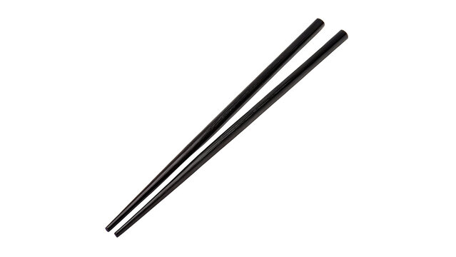 Pair of traditional black wooden chopsticks side view isolated on transparent background