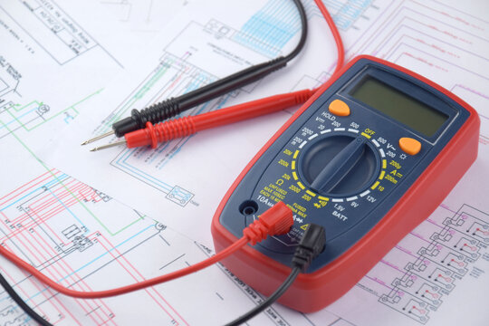 The digital multimeter electrical engineering drawings, circuit breaker and pencils