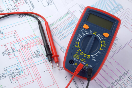 The digital multimeter electrical engineering drawings, circuit breaker and pencils