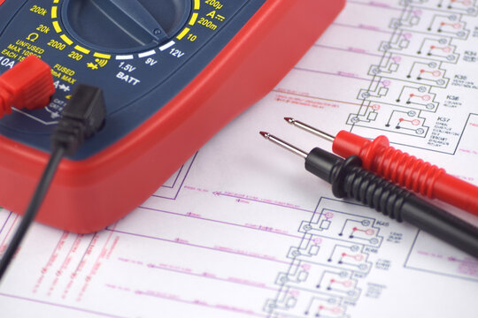 The digital multimeter electrical engineering drawings, circuit breaker and pencils