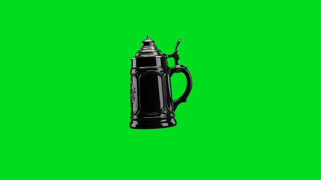 A detailed black ceramic beer stein isolated against a bright green background