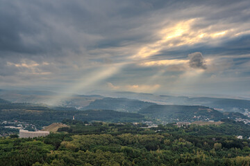 Obraz premium View of the mountains and Kislovodsk from the observation decks of the Kislovodsk Park. Evening sunset over the mountains of Kislovodsk.