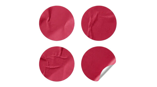 Four crimson red round stickers with various textures and peeling edge, isolated on transparent background