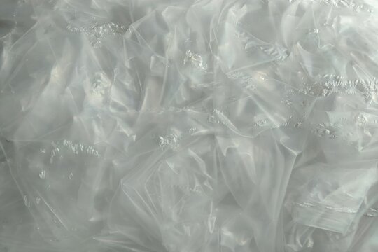 Crumpled transparent plastic texture background, close-up shot